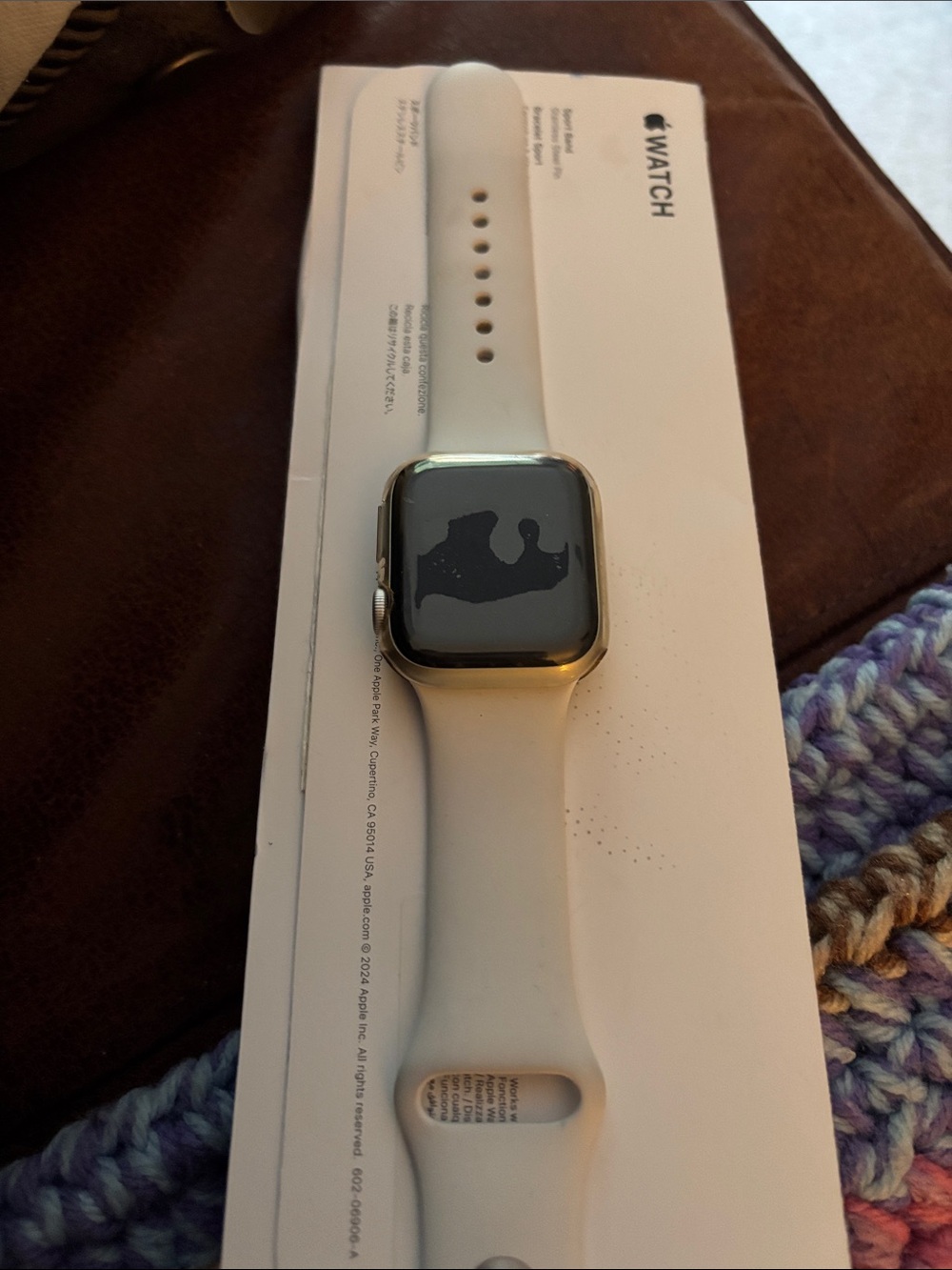 Apple Watch with White Sport Band and silver accent - with face protector